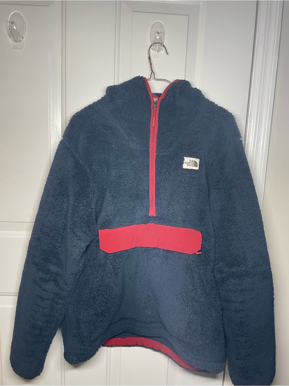 The North Face Men’s Navy Sherpa Pullover with Red Accents